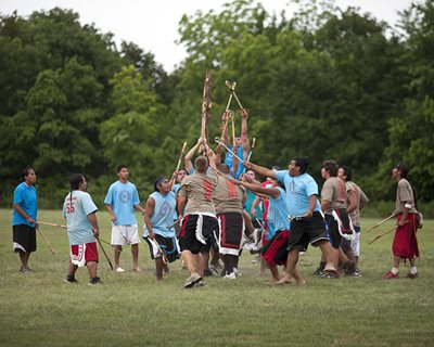 People playing stickball